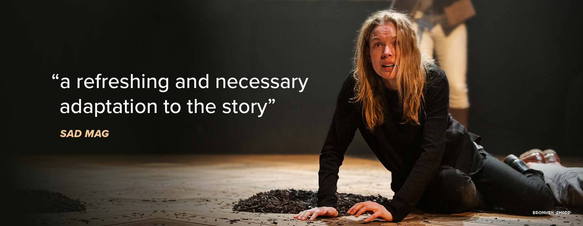 Sad Mag calls Prince Hamlet “a refreshing and necessary adaptation to the story.” A woman lying next to a pile of stones hoists herself up from the ground. 