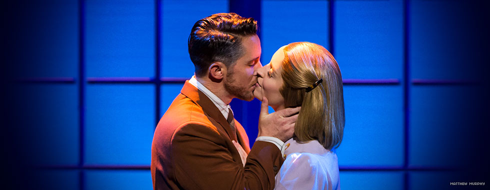 Captain von Trapp embraces Maria with a kiss in a moment of passion.