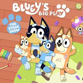 An illustration depicts an anthropomorphic cartoon family of four Blue Heeler breed of dog casually posing together amid children’s toys scattered around them. 