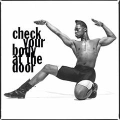 A Black male dancer strikes a pose wearing boots and spandex shorts. His arms point to the title of the film Check Your Body at the Door.