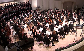 The entire orchestra performs on stage.