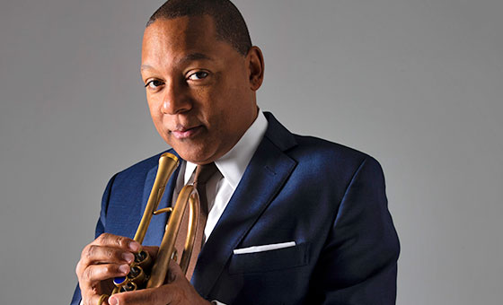 Wynton Marsalis stands with his trumpet.