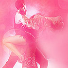 A male salsa dancer dips a female dancer.