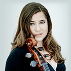 Weilerstein has long hair and holds her cello close.