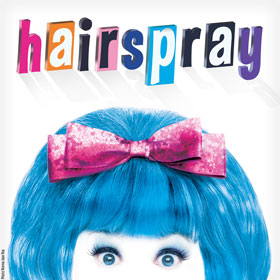 An illustration depicts a girl’s beehive hairdo adorned with a bow.